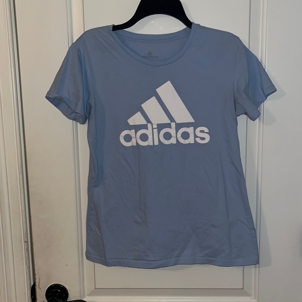 Adidas logo, light blue t-shirt, size medium.